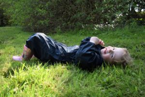 Child lying in the grass