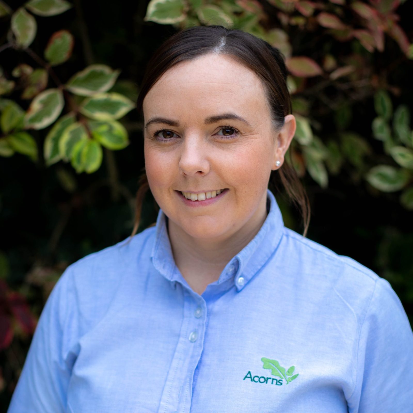 Acorns Nurseries A person in a blue shirt with an 